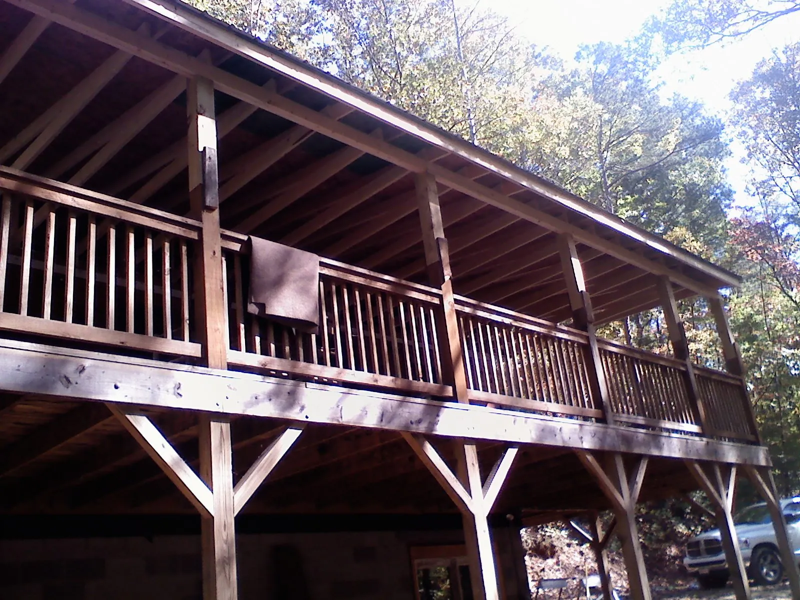 Timber framing under a new elevated porch and deck — Roof Leak Repair in North Springfield by Roofing Brothers